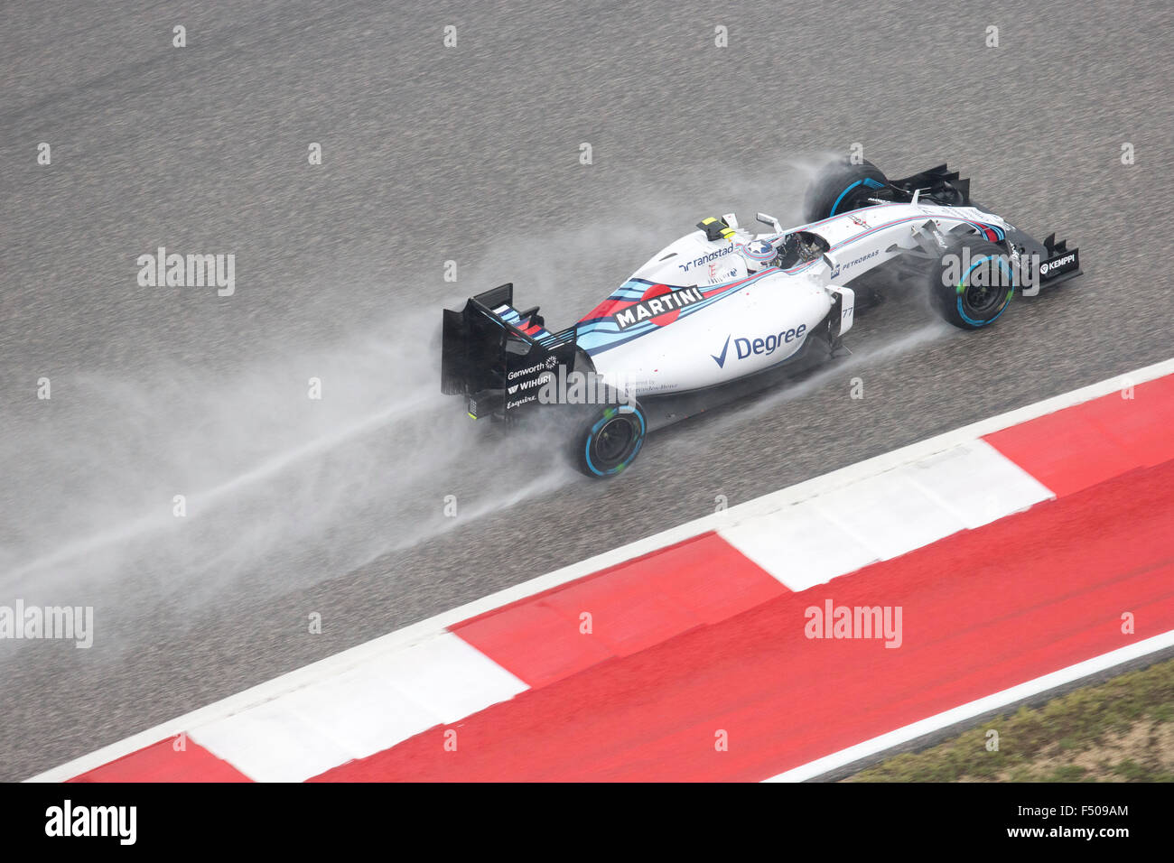 Austin, Texas USA October 25, 2015: Formula 1  driver Valtteri Bottas of Williams Martini races in qualifying at a soaked Circuit of the Americas track in Sunday. Race officials are insistent on keeping Sunday's United States Grand Prix on schedule despite continued bad weather. Credit:  Bob Daemmrich/Alamy Live News Stock Photo