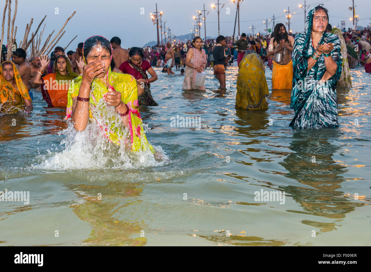 People taking bath early morning at the Sangam, the confluence of the ...