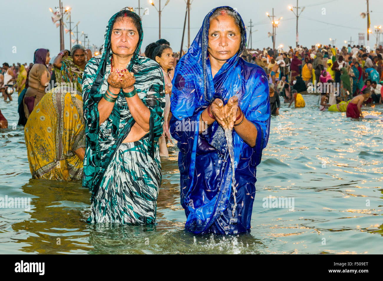 People taking bath early morning at the Sangam, the confluence of the