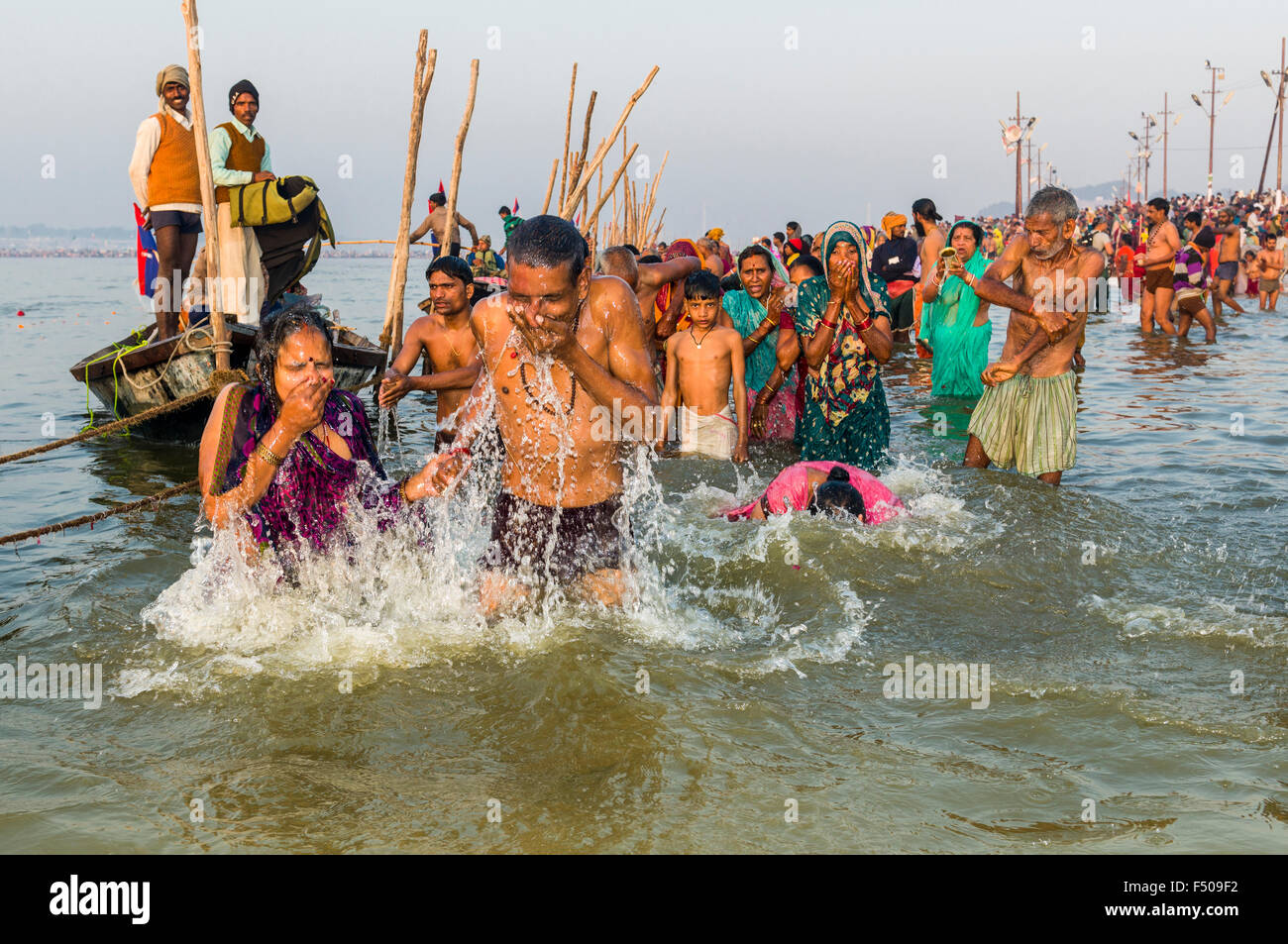 People taking bath early morning at the Sangam, the confluence of the