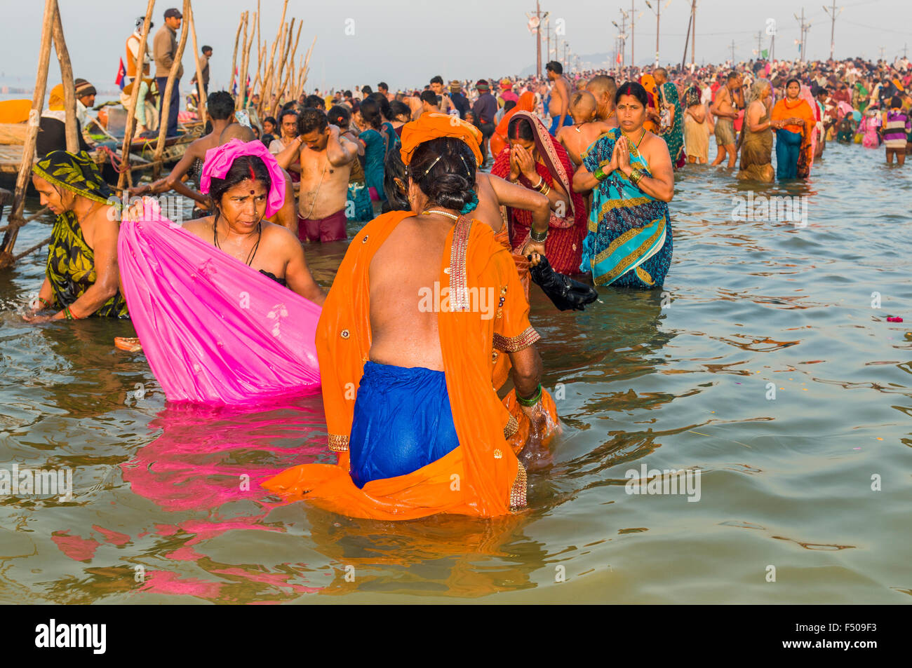 People taking bath early morning at the Sangam, the confluence of the