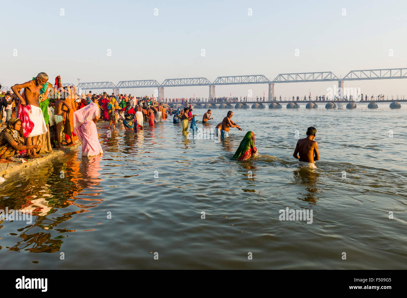 People taking bath early morning at the Sangam, the confluence of the
