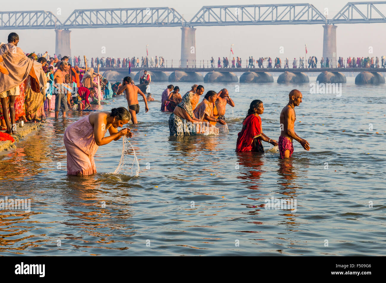 People taking bath early morning at the Sangam, the confluence of the