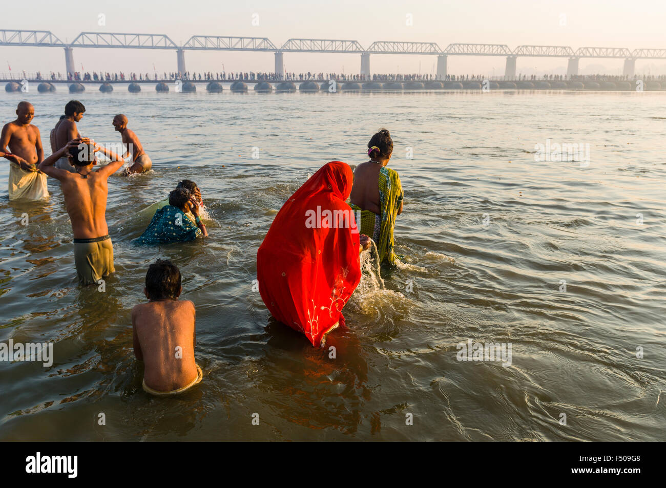 People taking bath early morning at the Sangam, the confluence of the