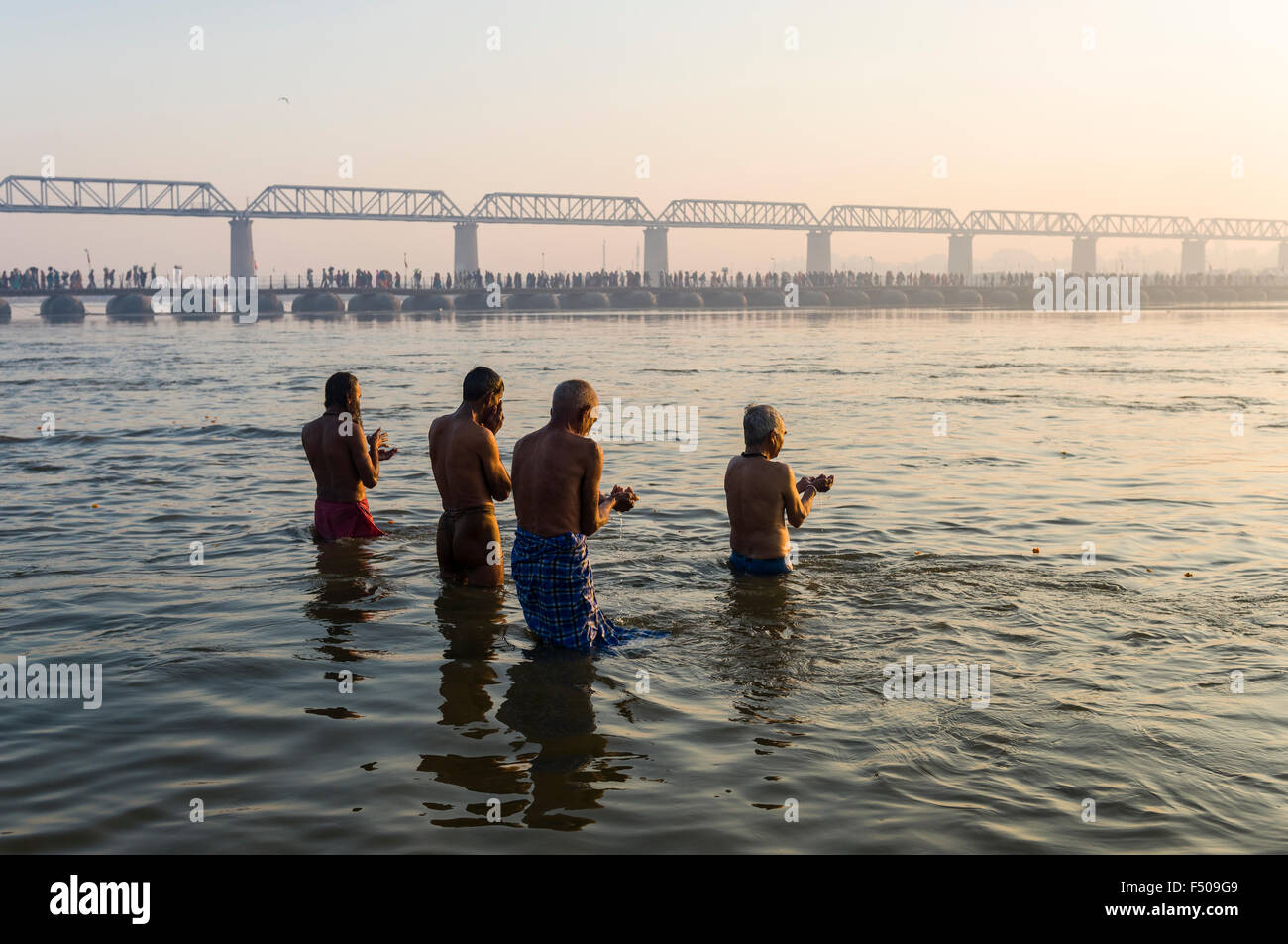 People taking bath early morning at the Sangam, the confluence of the