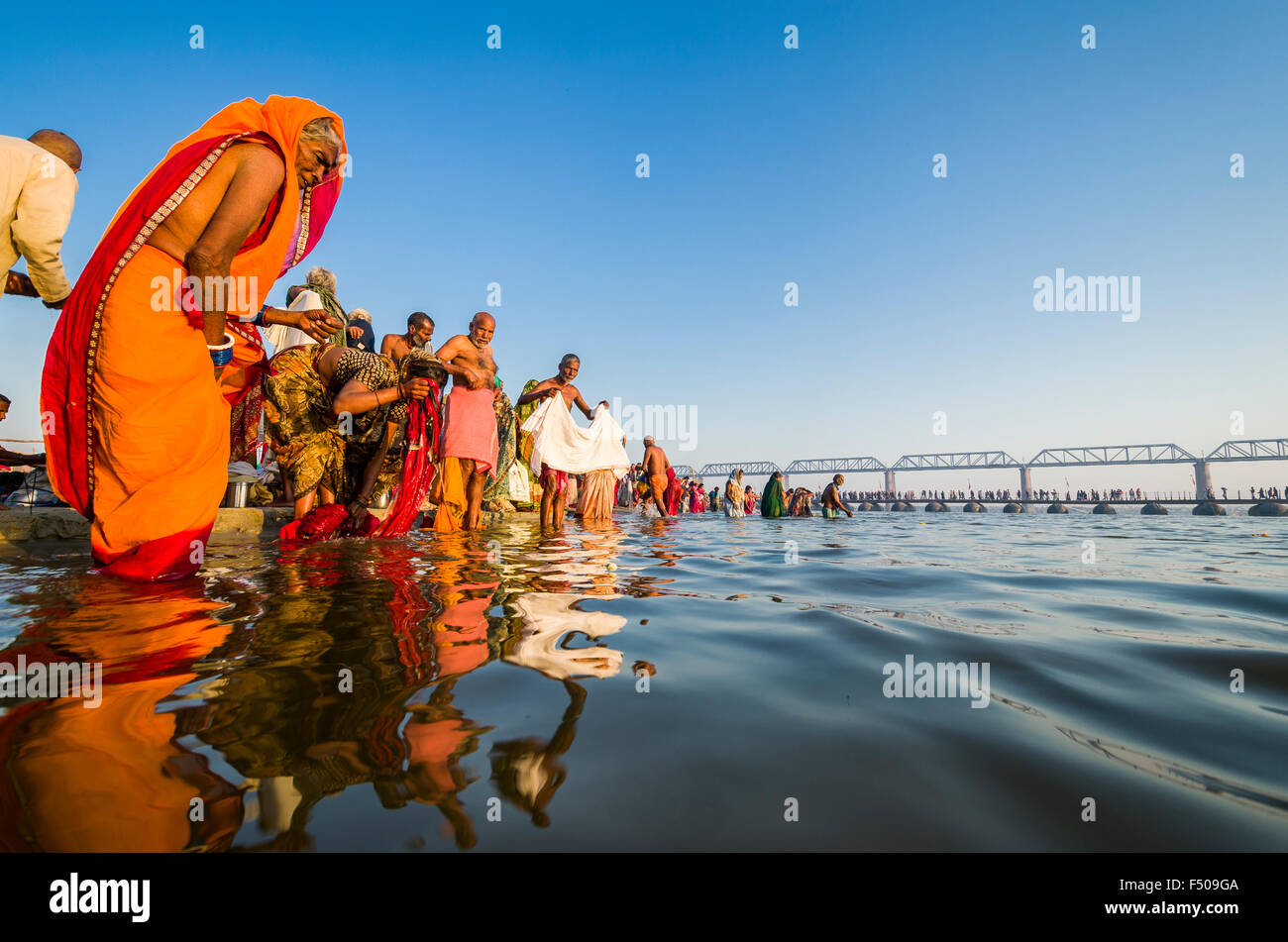 People taking bath early morning at the Sangam, the confluence of the
