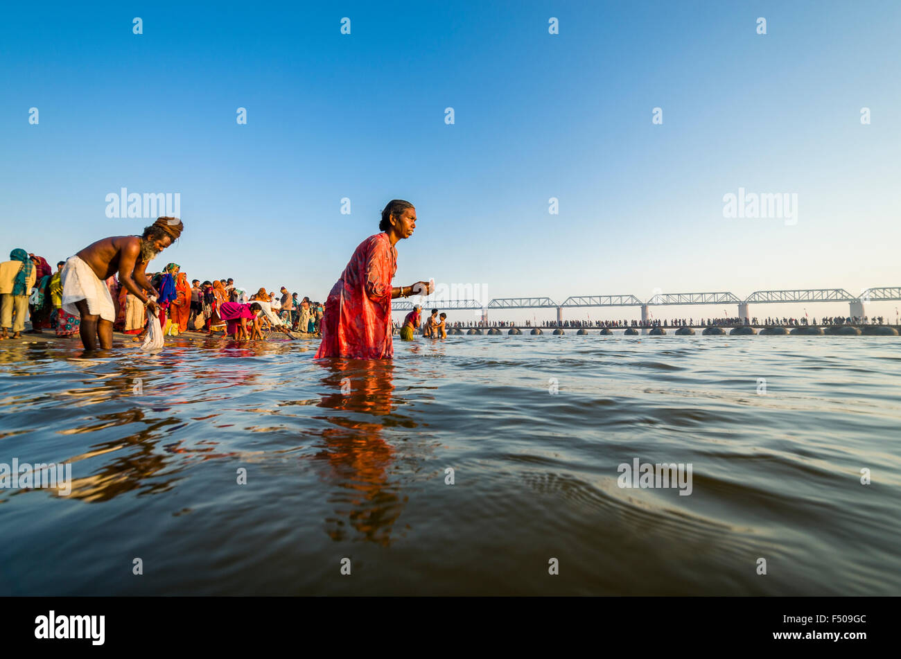 People taking bath early morning at the Sangam, the confluence of the