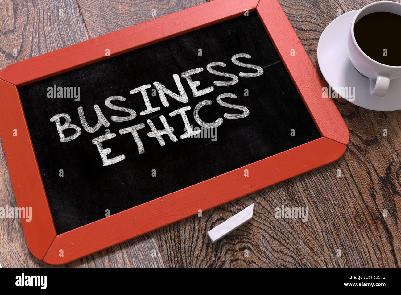 Business Ethics - Chalkboard with Hand Drawn Text. Stock Photo