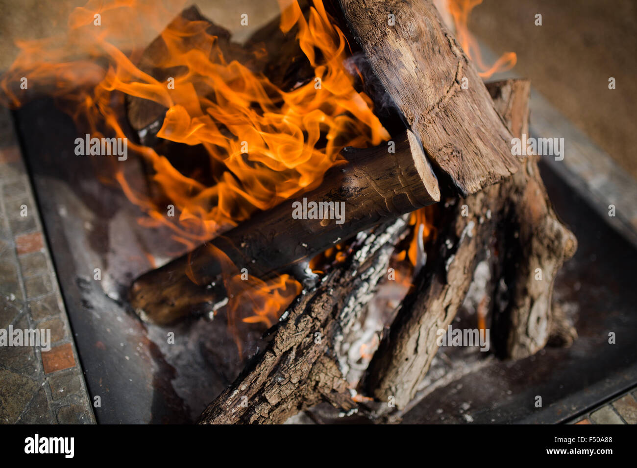 A stack of logs burns intensely in a campfire Stock Photo Alamy