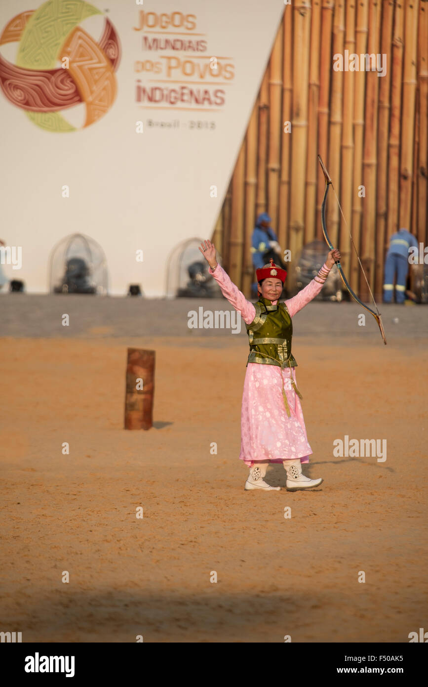 Palmas, Tocantins State, Brazil. 24th Oct, 2015. A female Mongol indigenous archer celebrates a win during the archery competition at the International Indigenous Games, in the city of Palmas, Tocantins State, Brazil. Photo Credit:  Sue Cunningham Photographic/Alamy Live News Stock Photo