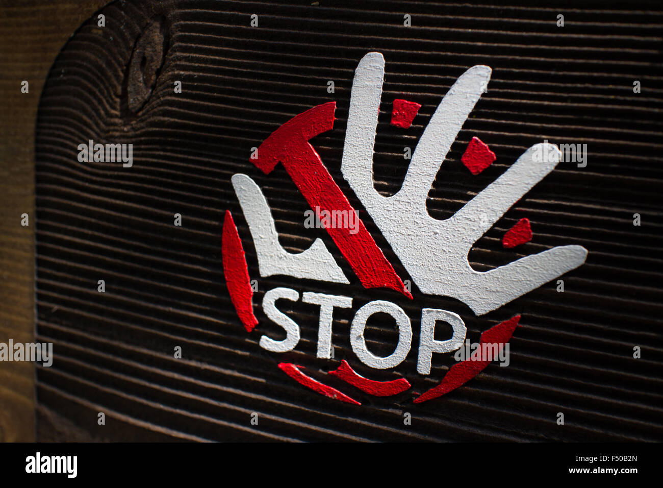 Stop sign with a hand and a cross through it Stock Photo
