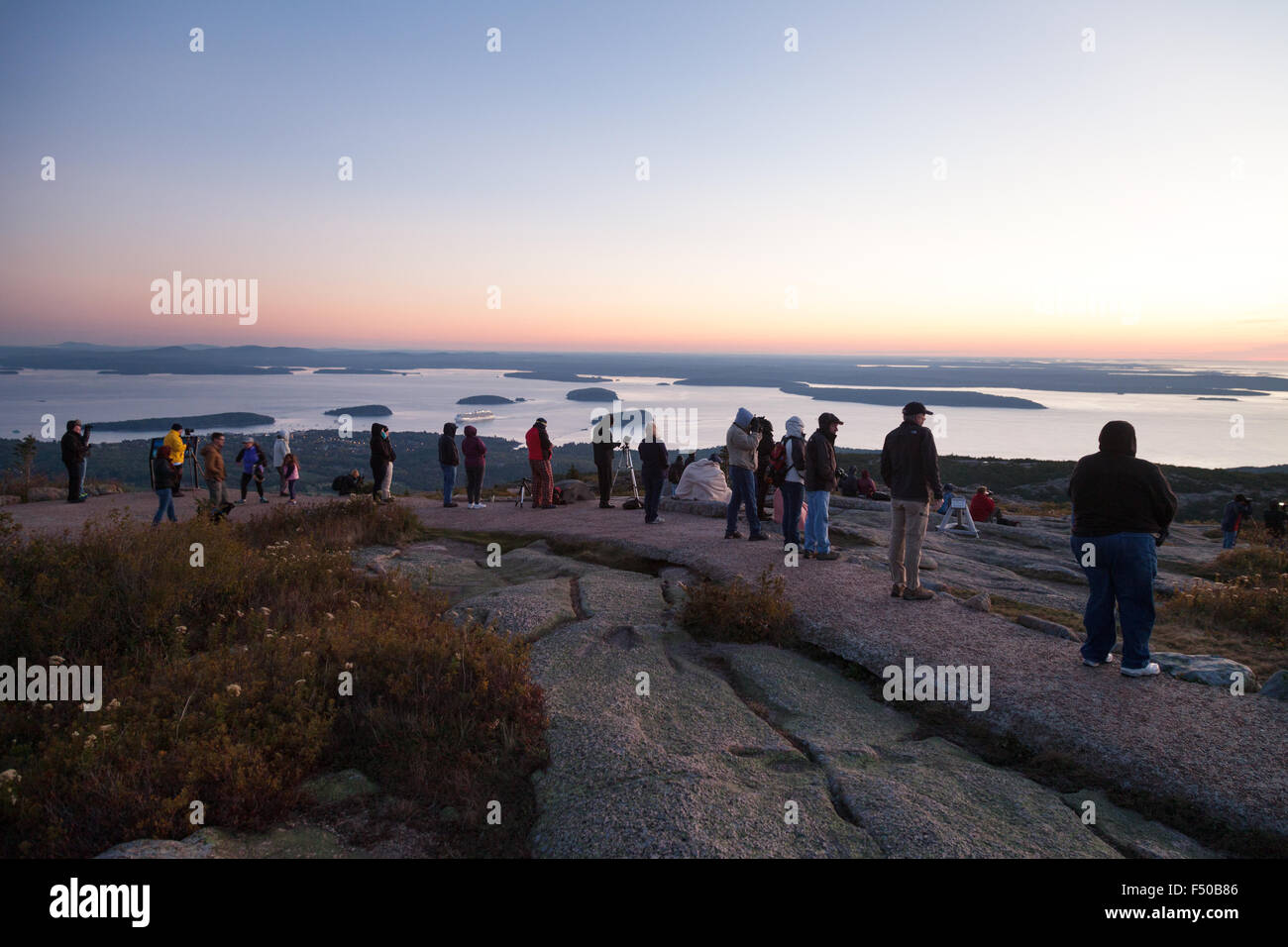 New England Tourists watching the sunrise from the top of Cadillac Mountain, Mount Desert Island, Acadia National Park, Maine USA Stock Photo