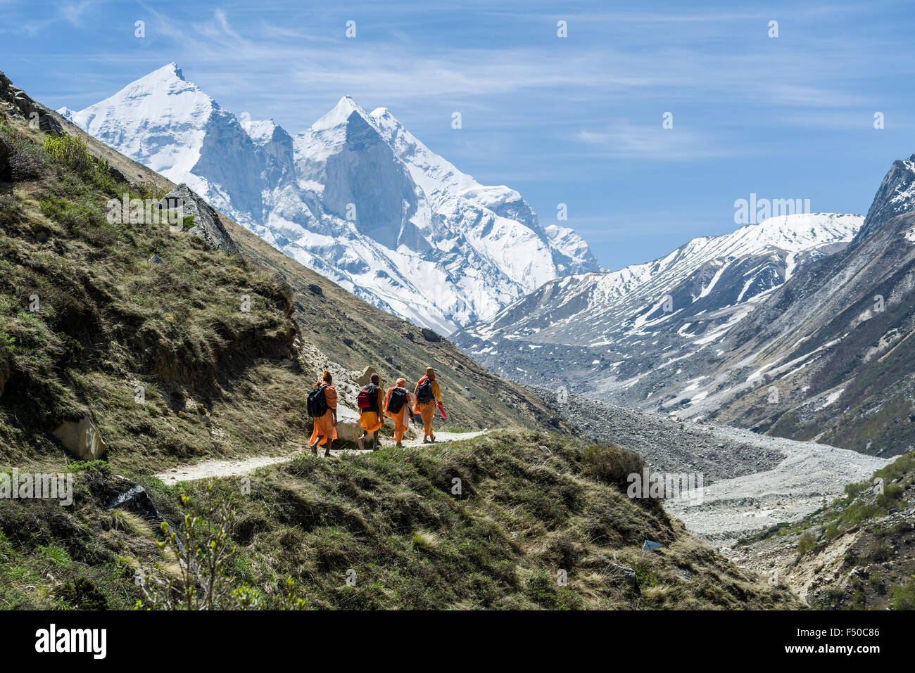 Four Sadhus, holy men, on their way up to Gaumukh, the main source of the holy river Ganges Stock Photo