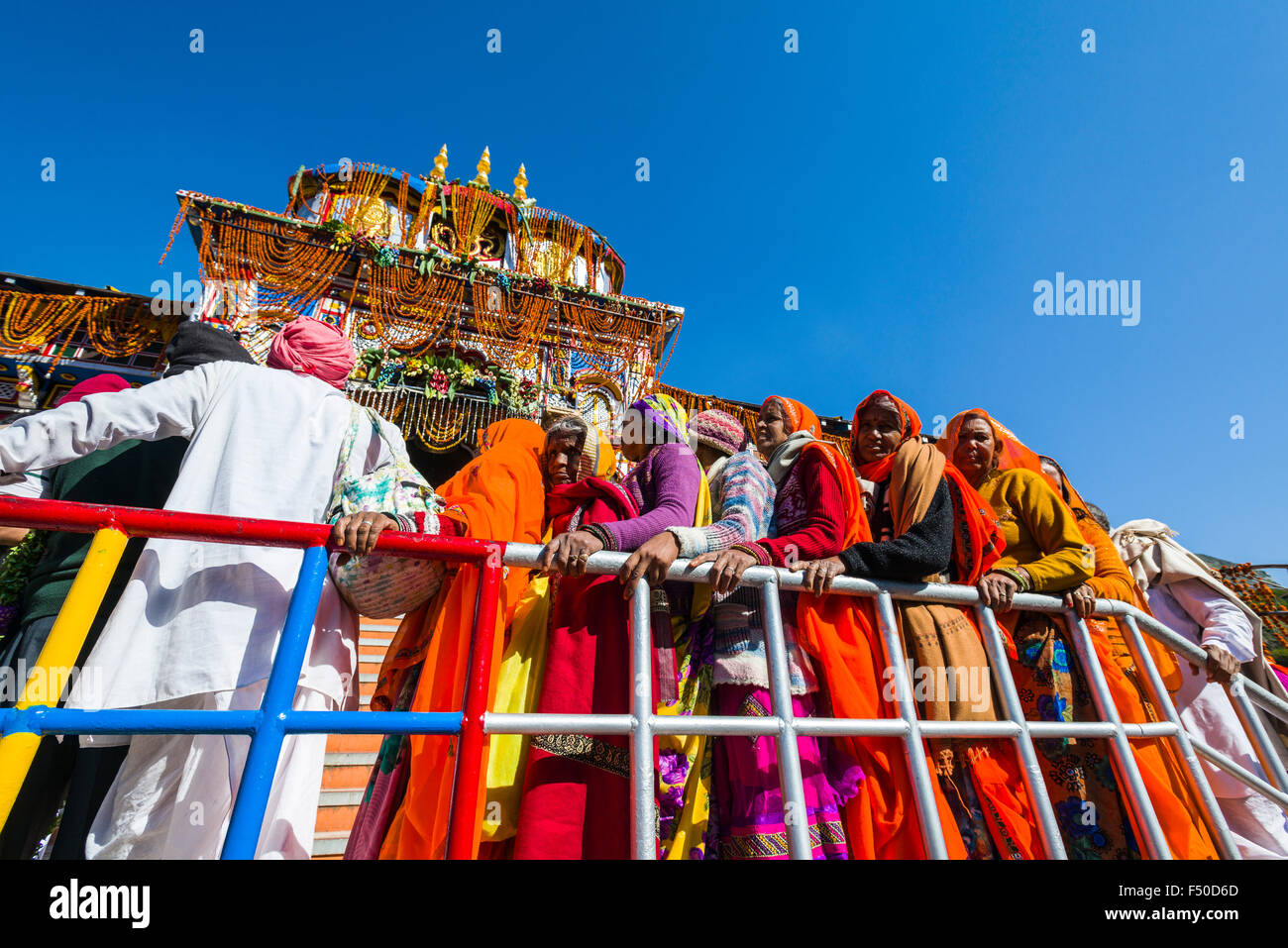 Many pilgrims are gathering in front of the colorful Badrinath Temple, one of the Dschar Dham destinations Stock Photo