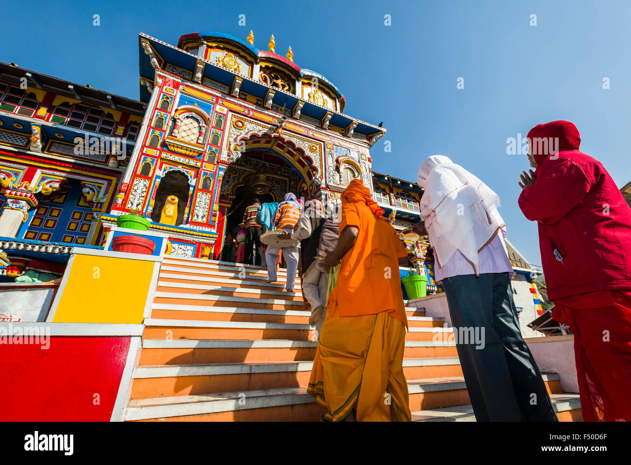 Many pilgrims are gathering in front of the colorful Badrinath Temple, one of the Dschar Dham destinations Stock Photo