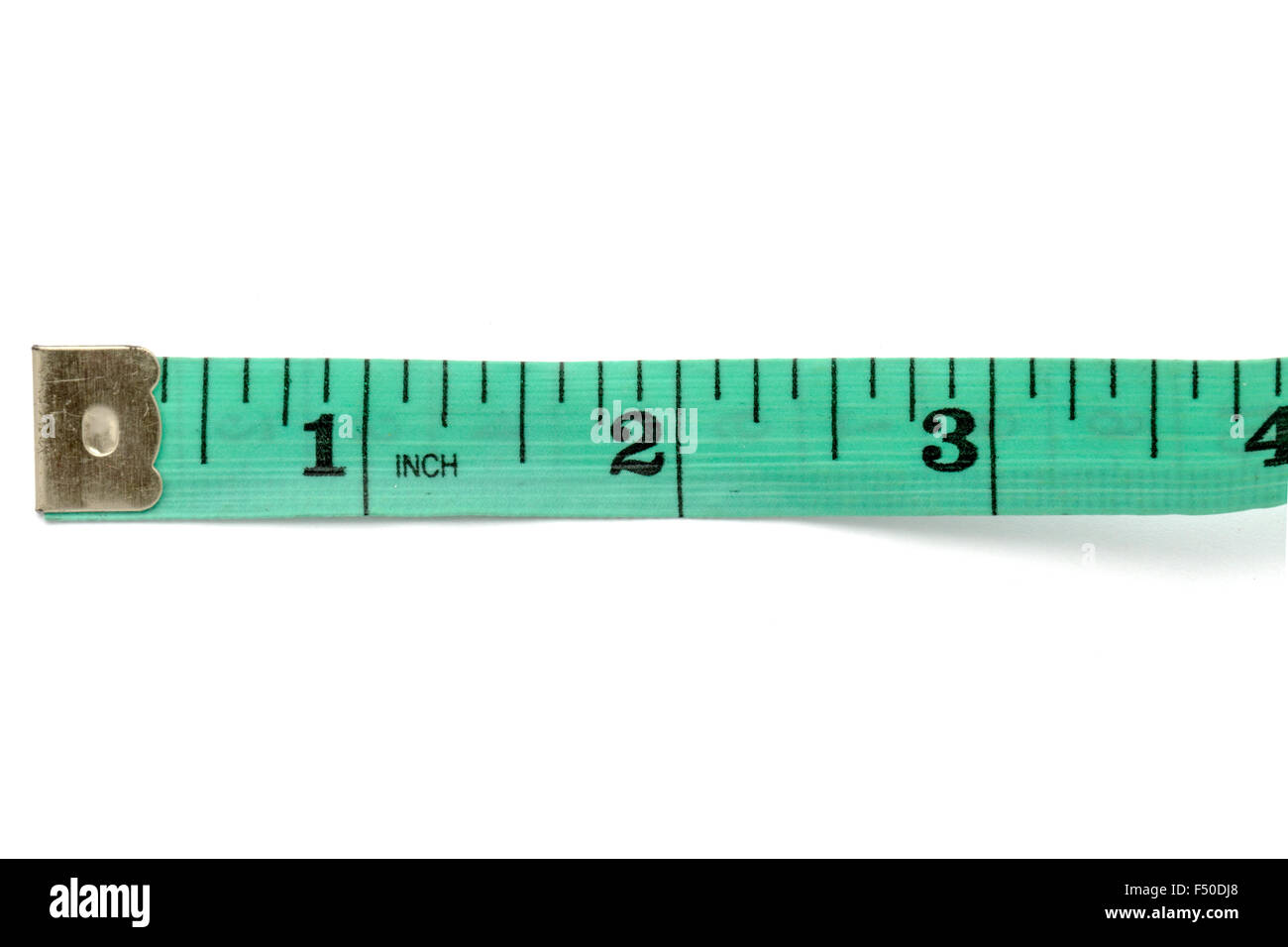 Green tape measure on white background Stock Photo