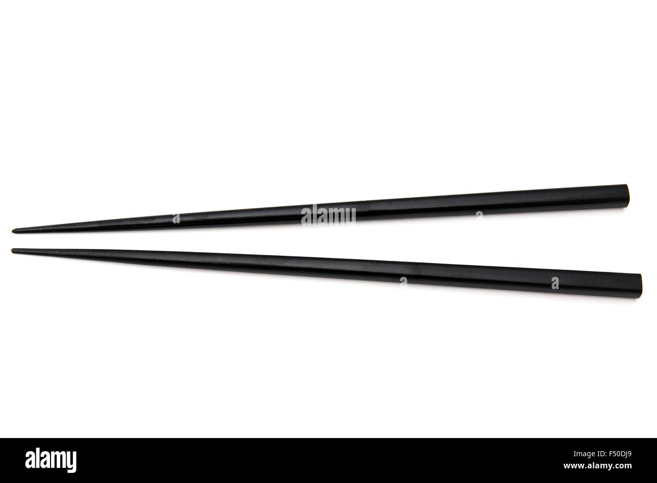 Black chopsticks isolated on white background Stock Photo
