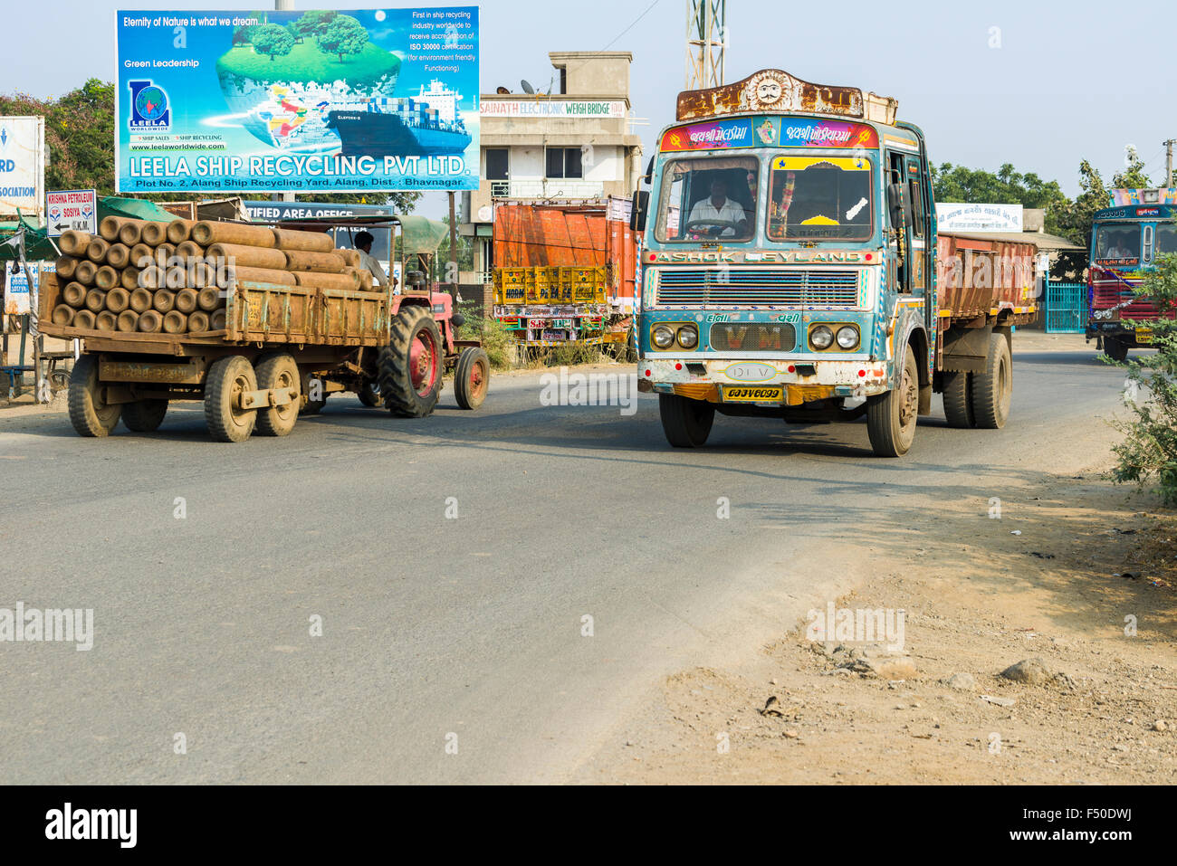 A truck and a tractor at the entrance of the infamous ship breaking yard Alang Stock Photo
