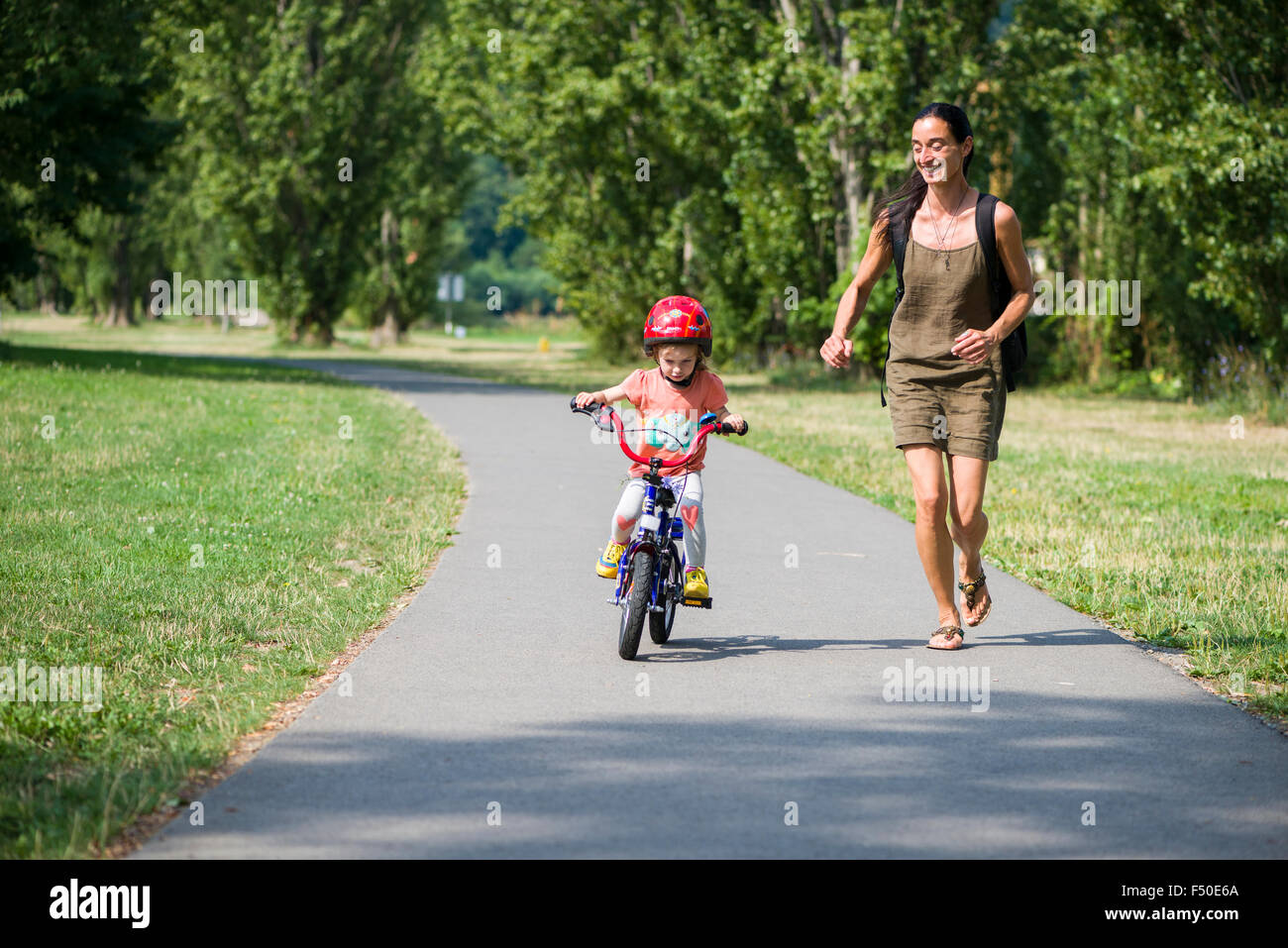 Child cycling helmet pavement hi res stock photography and images Alamy