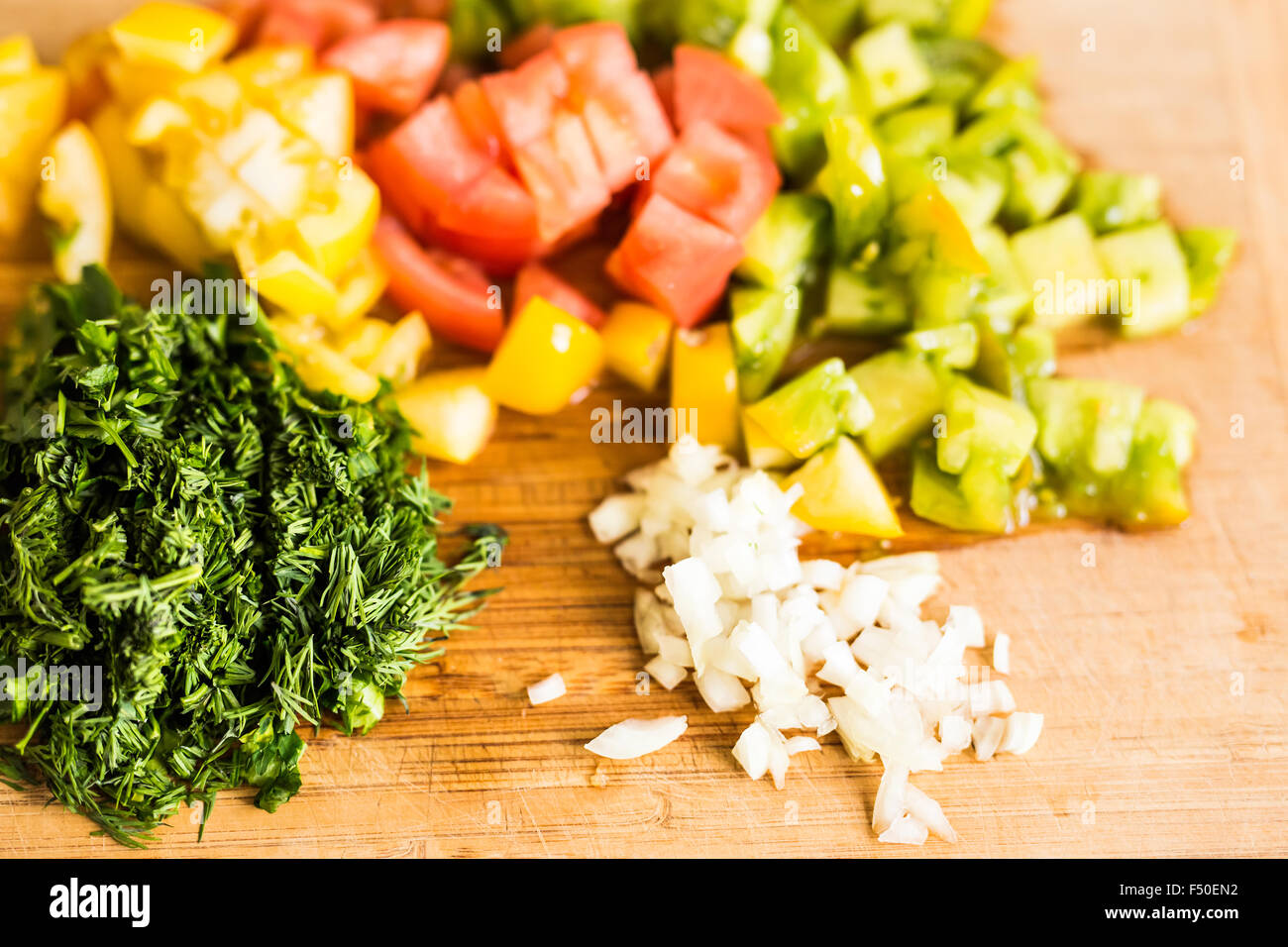 fresh chopped vegetables on a cutting  board Stock Photo