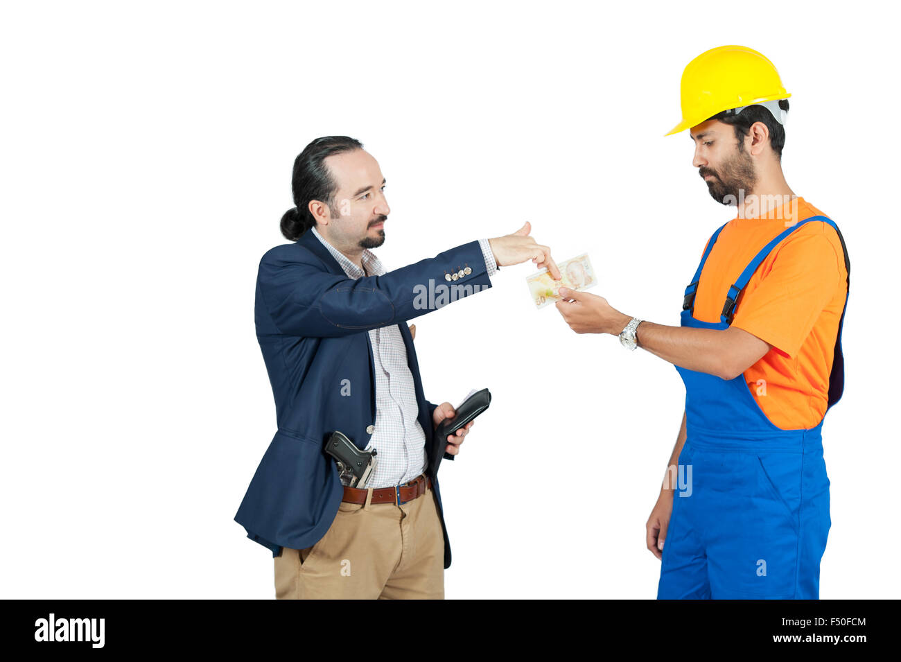 businessman paying hired blue collar laborer for services isolated on the white background Stock Photo