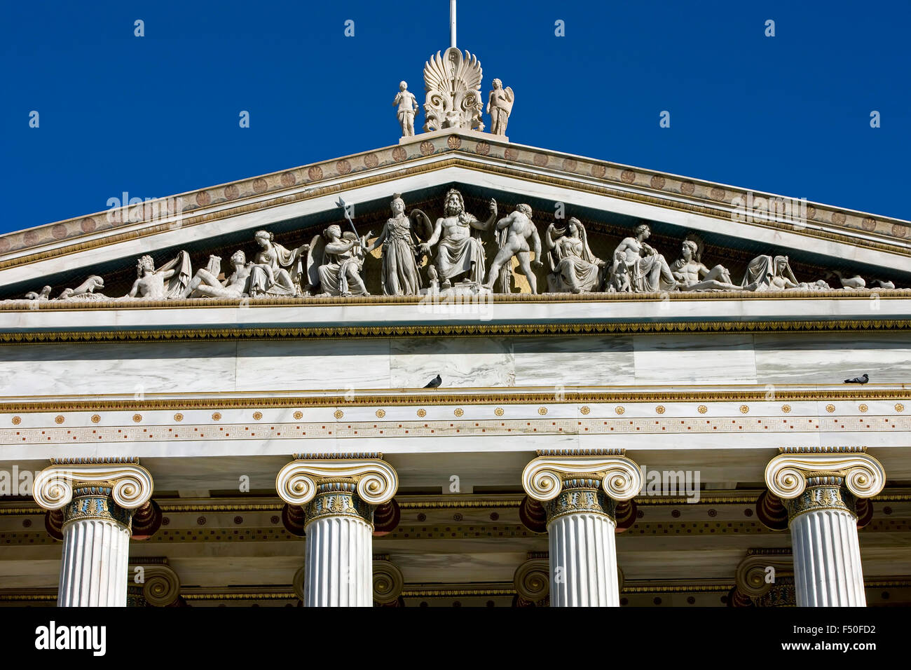 Pediment/ frieze of Athens academy building decorated with dodecatheon theme by architect Theophile Hansen.Panepistimiou str. GR Stock Photo