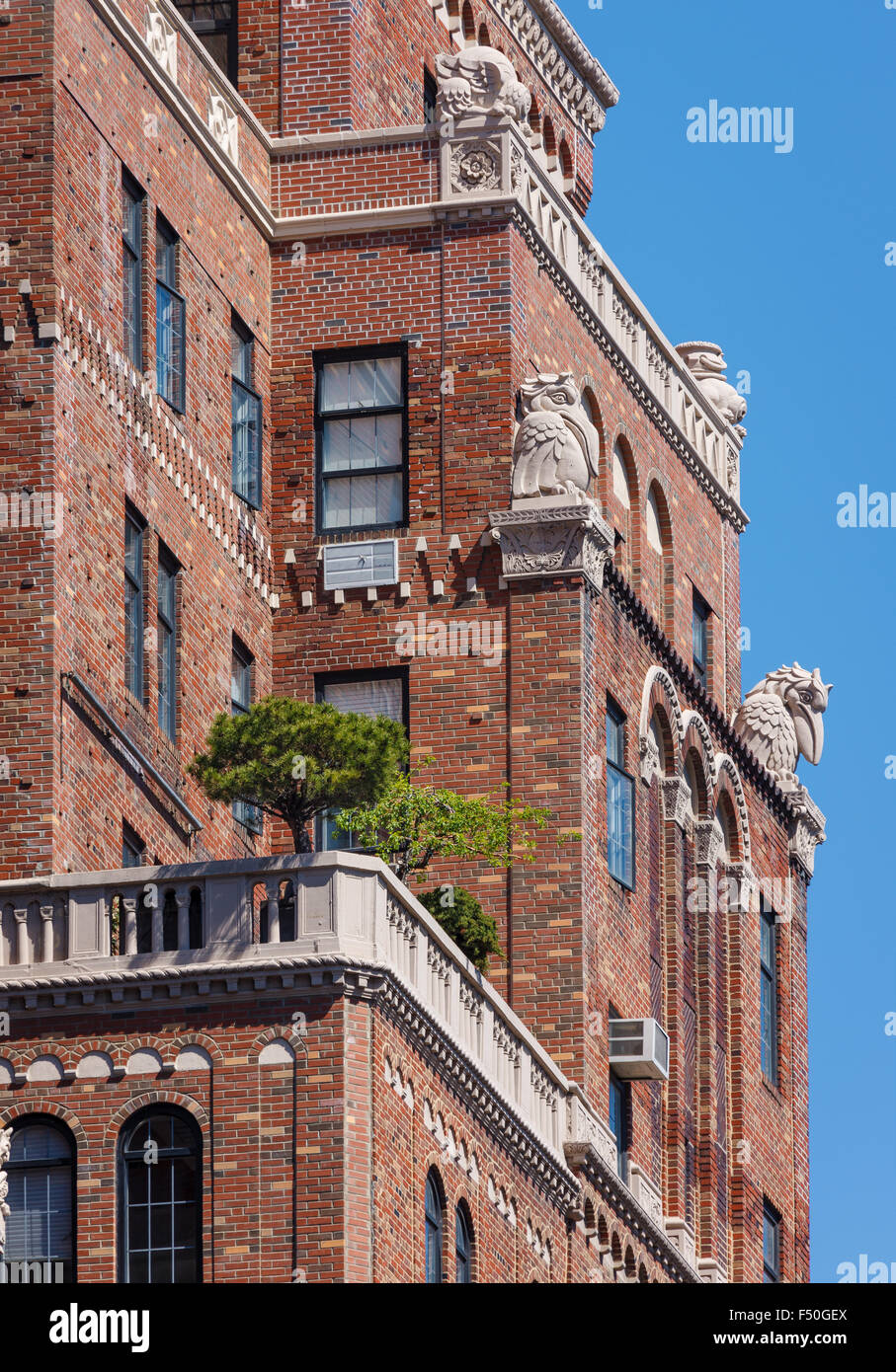 Architectural details of brick wall building with terraces and cartouches, Chelsea, Manhattan, New York City Stock Photo