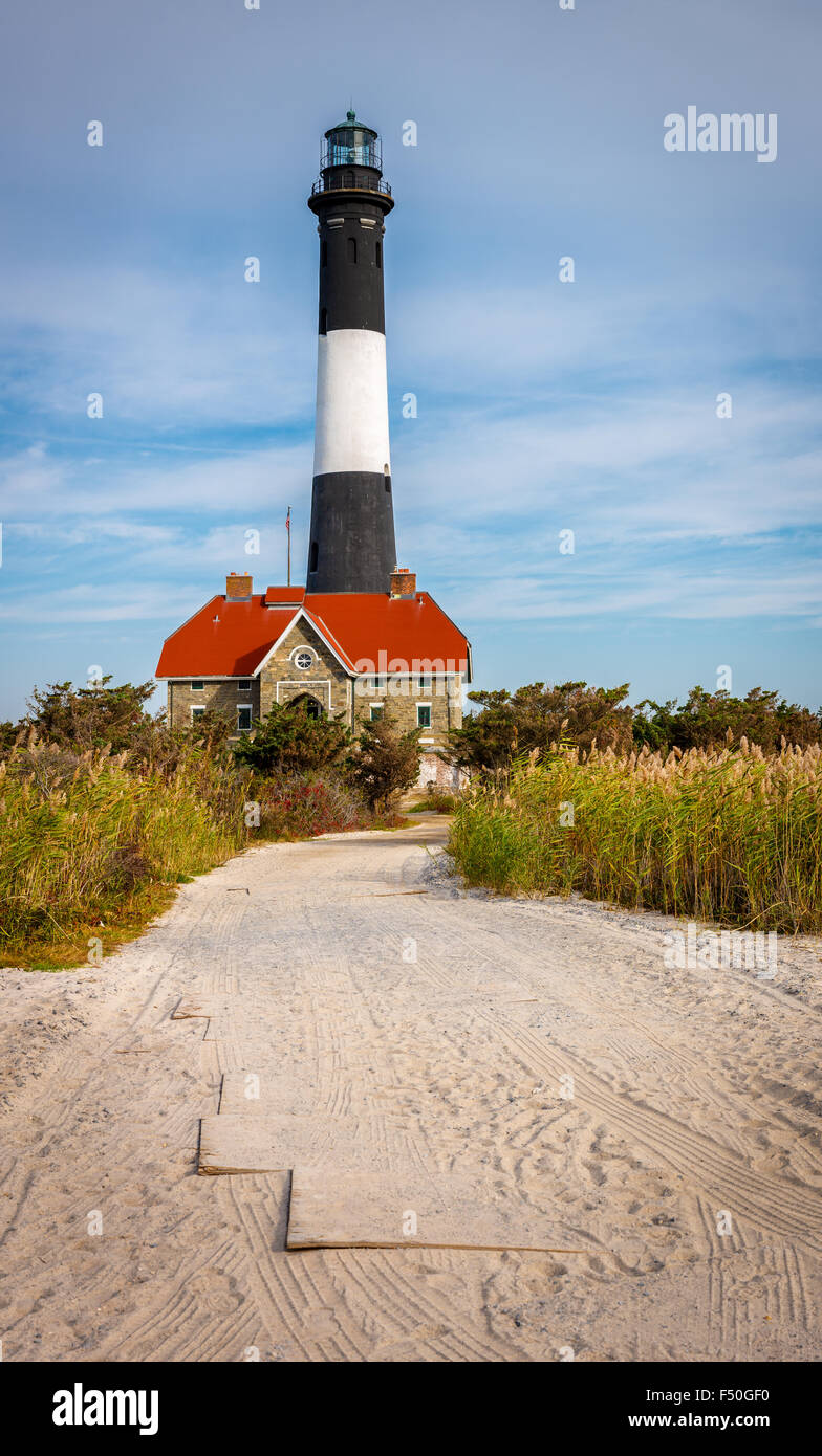 Fire Island lighthouse and house of lighthouse keeper, Bay Shore, Long Island, New York State Stock Photo