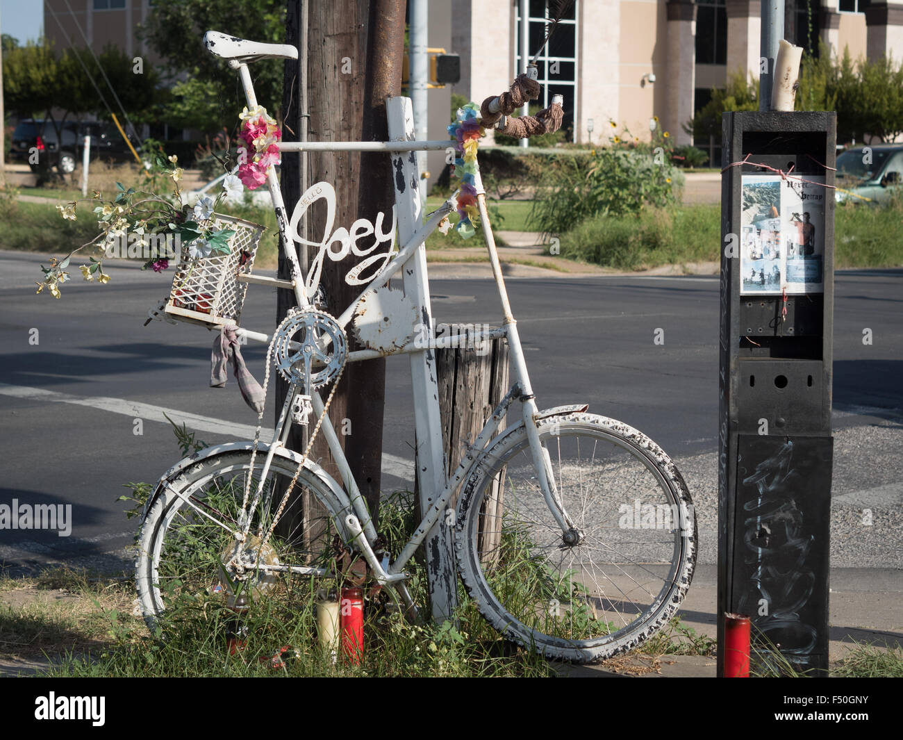 Ghost Bike at Pleasant Valley and Cesar Chavez: A white bicycle painted to memorialize someone killed in a road accident Stock Photo