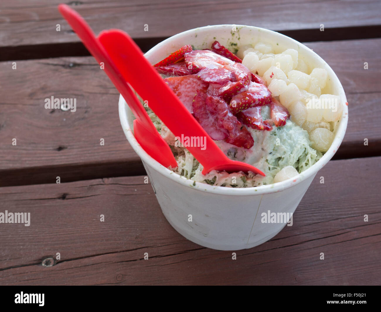 Green tea-flavored  shaved ice with strawberries and mochi Stock Photo