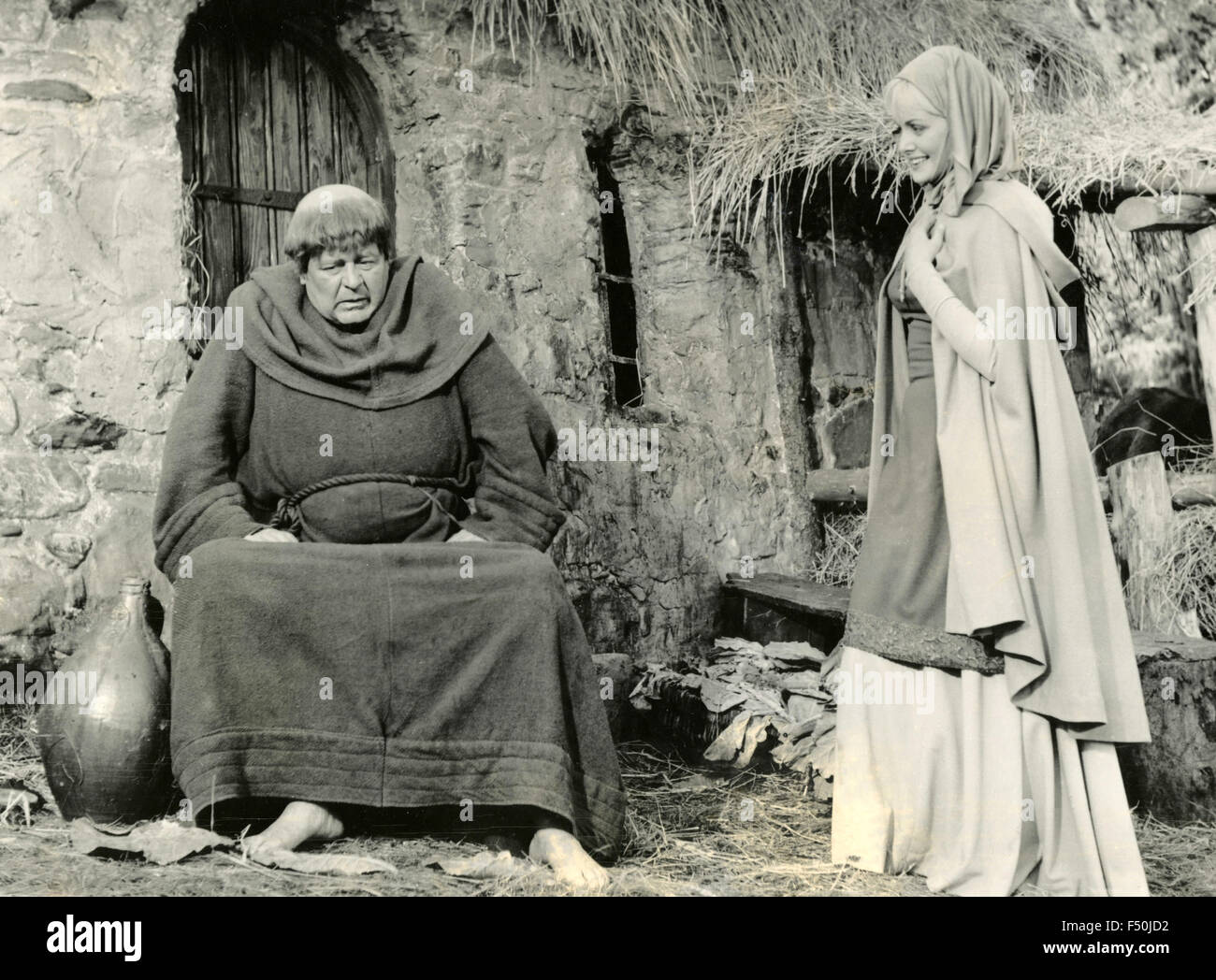 The actors Sarah Branch and Niall MacGinnis in a scene from the movie 'Sword of Sherwood Forest' , UK 1960 Stock Photo