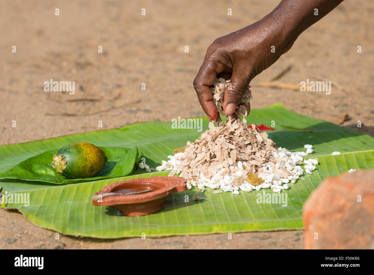 Prasad, offerings like bananas, rice and ghee to get cooked, are set up in a busy street during the Pongala festival Stock Photo