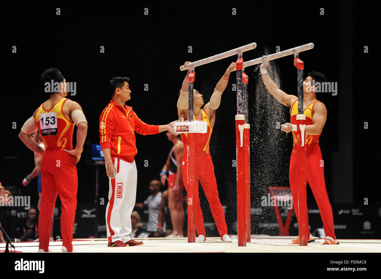 Oct. 25, 2015 - The Chinese men's gymnastics team prepares the parallel bars during the preliminary round of the 2015 World Gymnastics Championships held in Glasgow, United Kingdom. Credit:  Amy Sanderson/ZUMA Wire/Alamy Live News Stock Photo