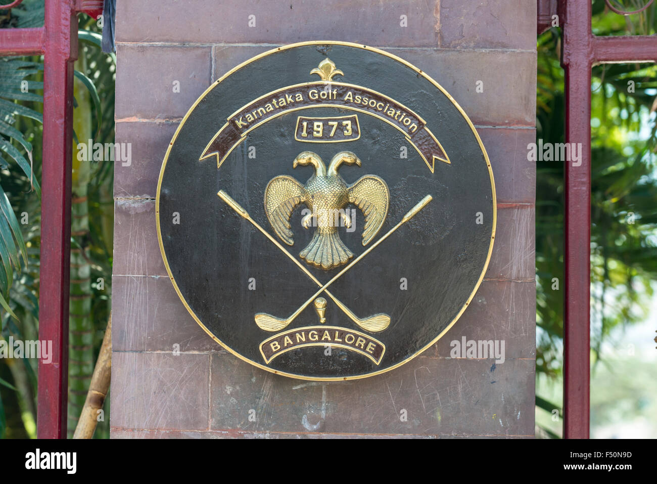 Hatchment of the Karnataka Golf Association at the entrance gate of the golf course Stock Photo