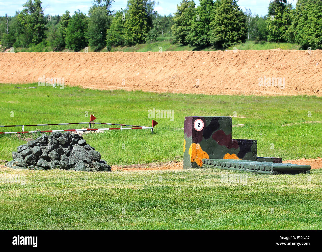 Place for shooting reinforced by logs on the training camp Stock Photo