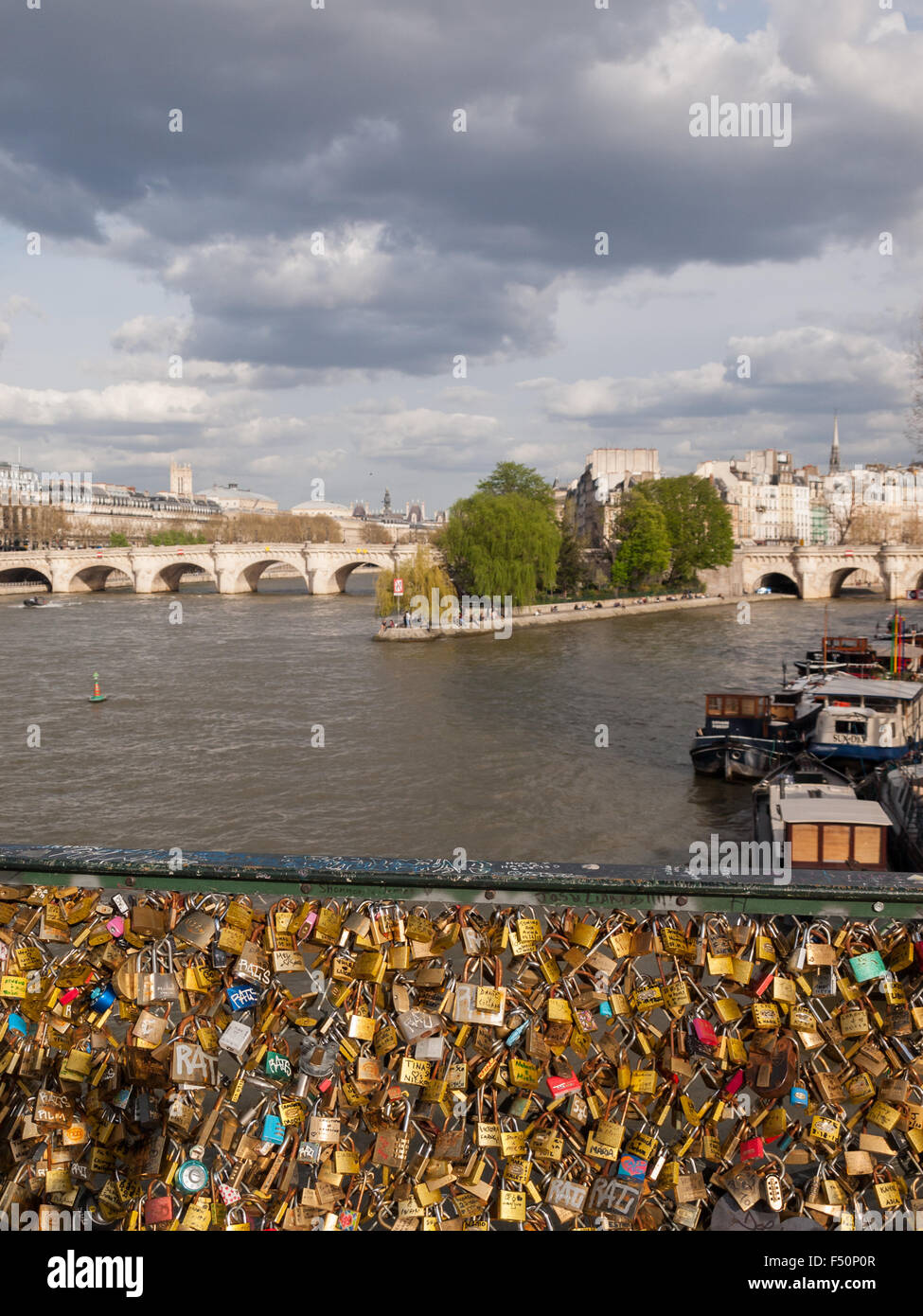 Padlocks covered bridge over Seine river Stock Photo Alamy