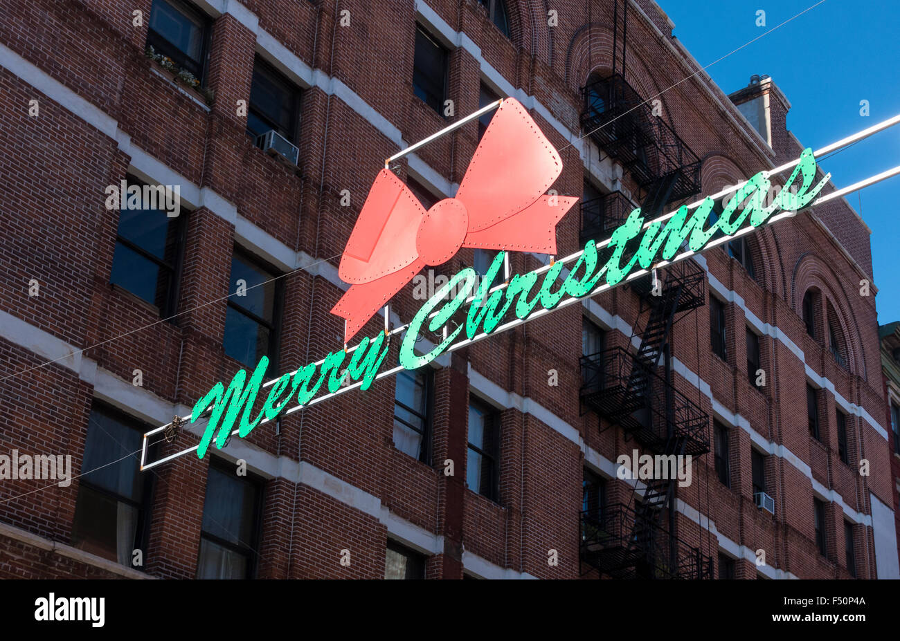 Merry Christmas banner across Mulberry Street in Little Italy in New York City Stock Image