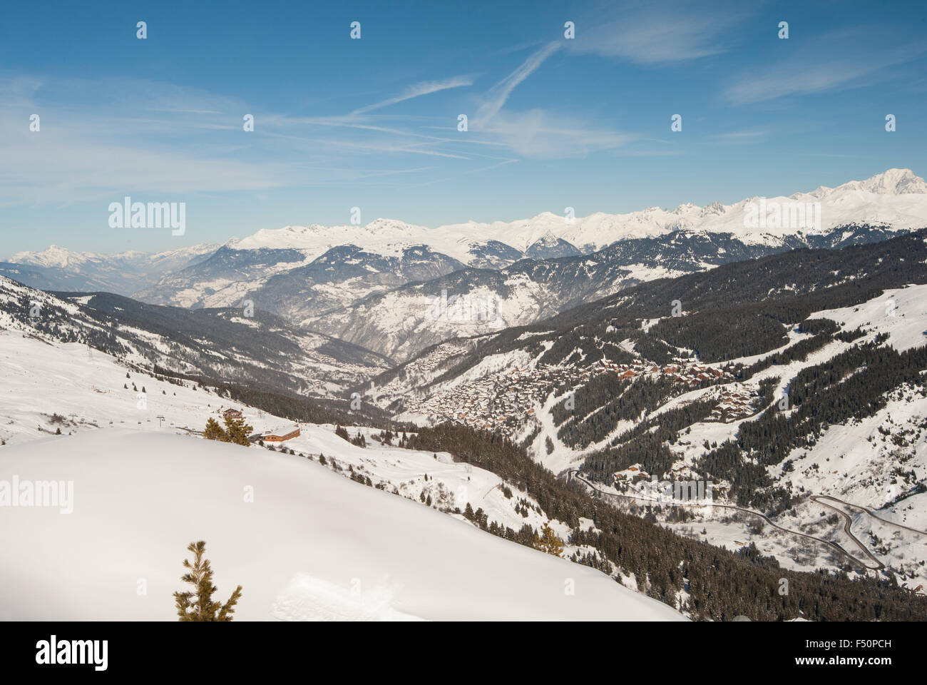 Panoramic view of a snow covered mountain range looking down valley Stock Photo