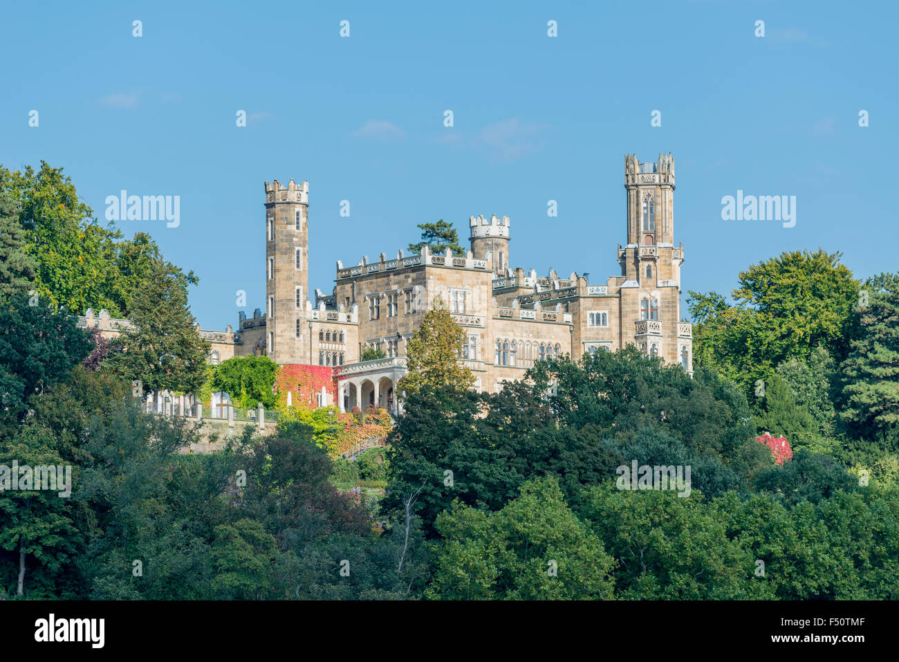 The castle Eckberg is overlooking the valley Elbe, surrounded by trees Stock Photo