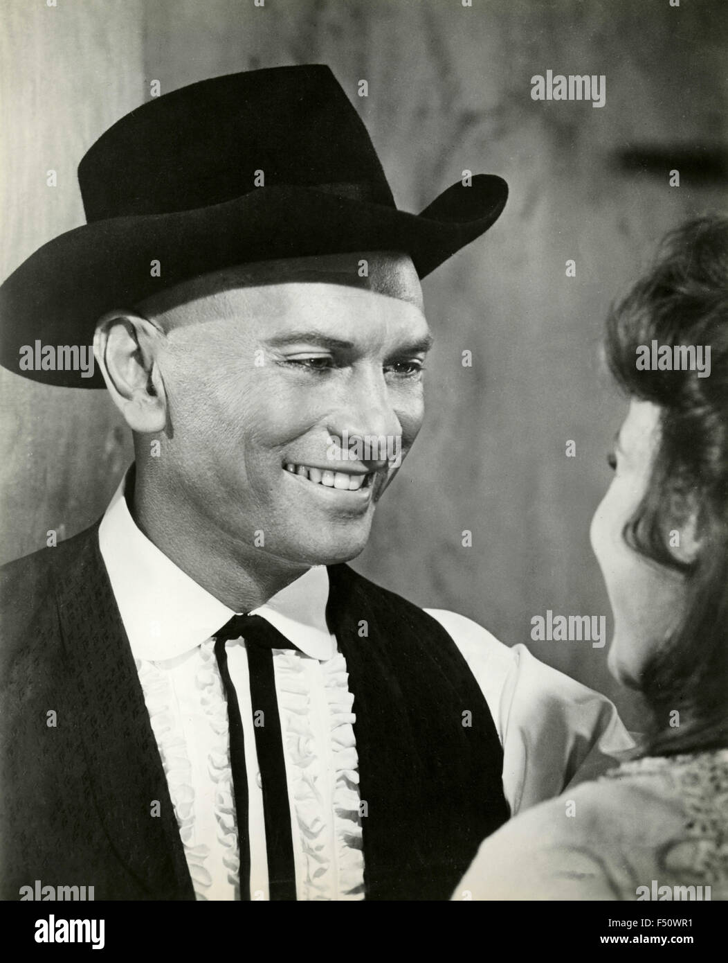 The American actor Yul Brynner in a scene from the movie 'Invitation to a gunfight', USA Stock Photo