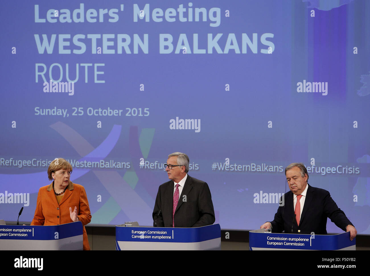 Brussels, Belgium. 26th Oct, 2015. European Commission President Jean-Claude Juncker (C), German Chancellor Angela Merkel (L) and the UN's High Commissioner for Refugees Antonio Guterres attend a press conference at the end of the special EU summit with Western Balkan nations situated along the migrant routes into Europe in Brussels, Belgium, on Oct. 26, 2015. The European Union (EU) and Balkan countries are seeking further cooperation on tackling migrant crisis at a mini summit held here on Sunday. Credit:  Zhou Lei/Xinhua/Alamy Live News Stock Photo