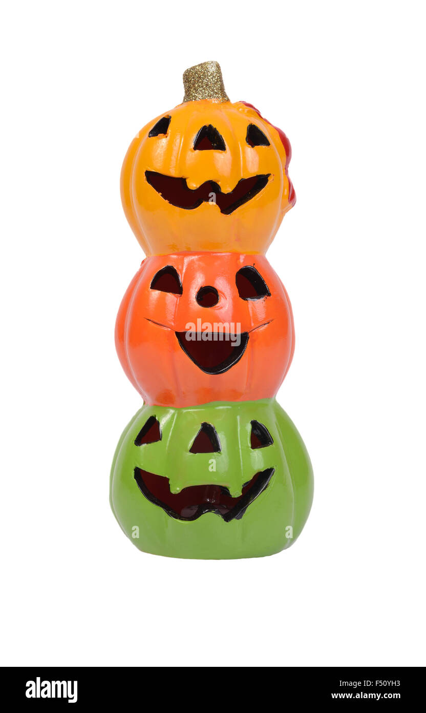 Three halloween pumpkin heads, yellow, orange and green on white background. Stock Photo