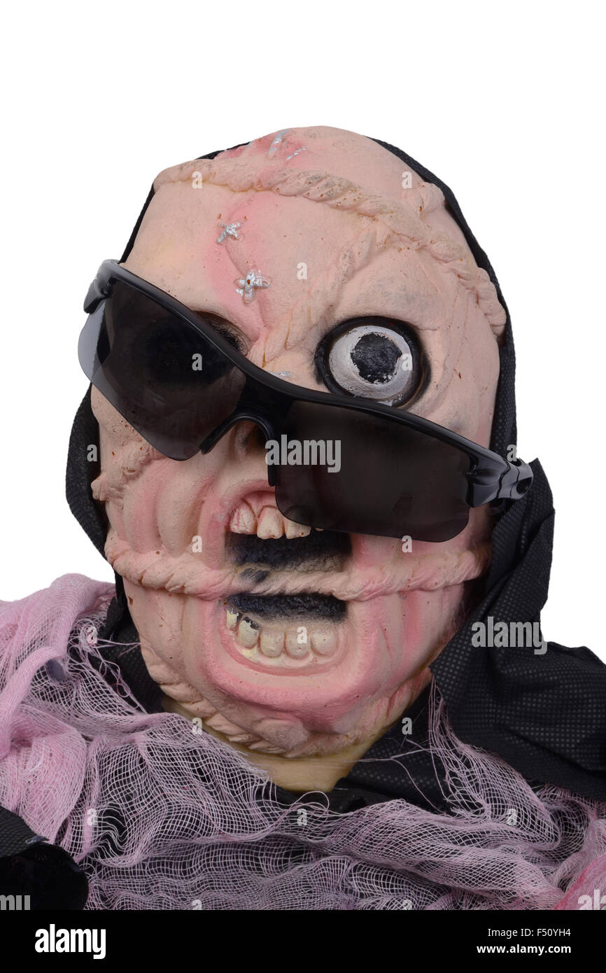 Halloween skull look so fear with black sunglasses on screaming face. Stock Photo