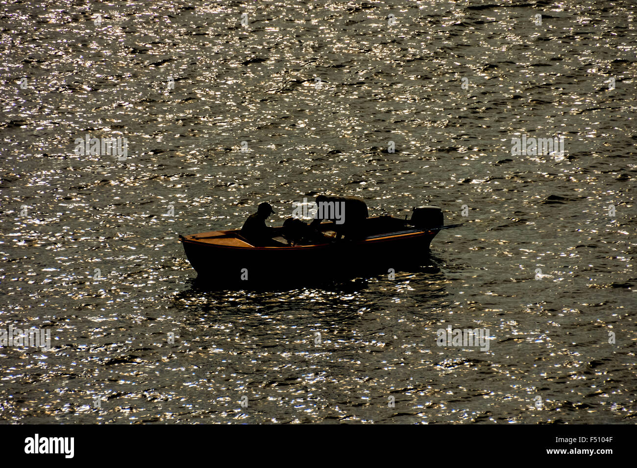 Silhouette Boat in the Ocean Stock Photo - Alamy