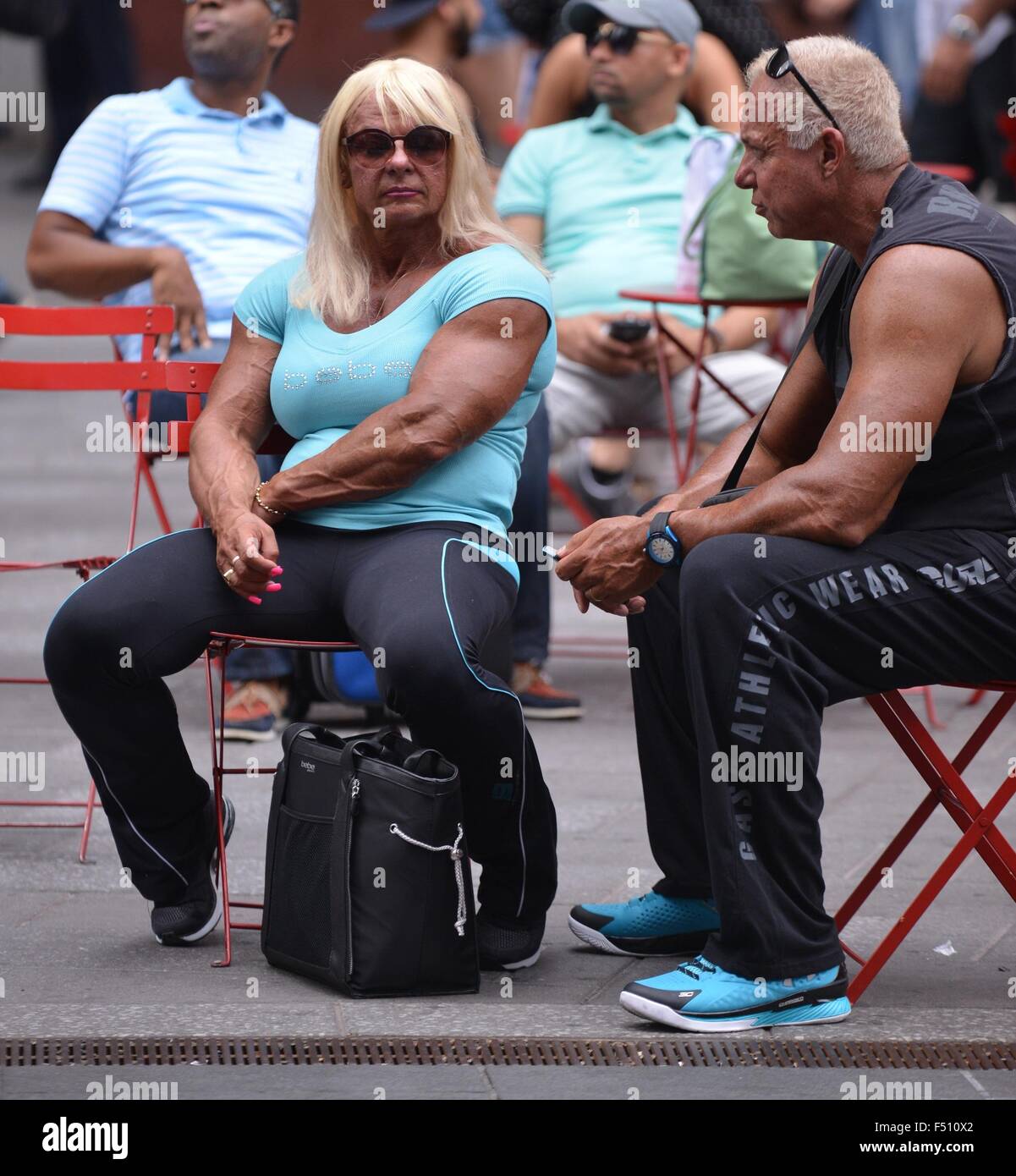 Bodybuilder Carmen Brady sitting in Times Square Featuring Carmen