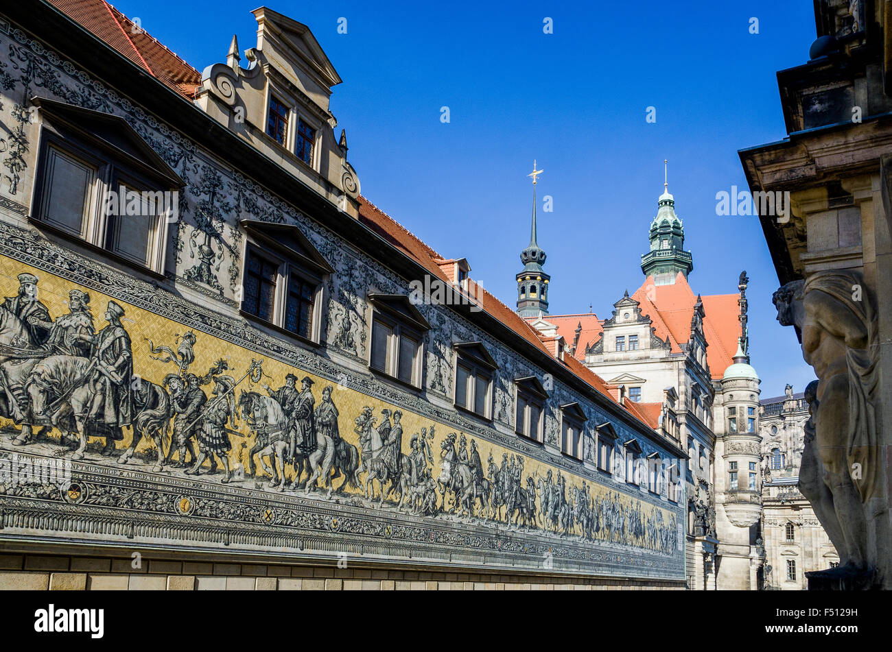 The Fürstenzug, the whole line of saxonian kings in porcellan, the Dresden Castle in the back Stock Photo