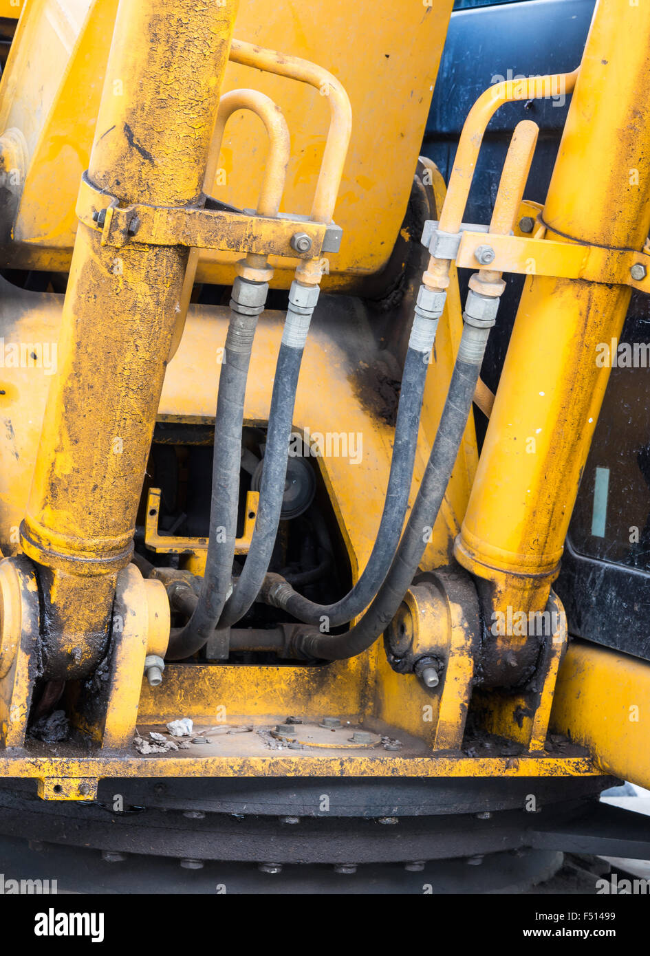 Hydraulic pipe of the old excavator in construction site Stock Photo