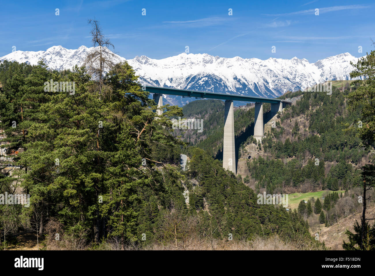The bridge Europabrücke seen from the Brenner road, snow capped mountains in the distance Stock Photo