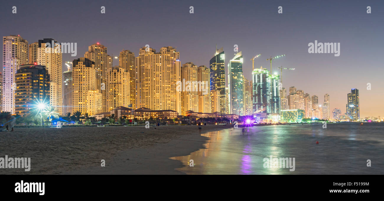 Night view of beach and skyline of high-rise apartment blocks at JBR Jumeirah Beach Residences in Dubai UAE Stock Photo