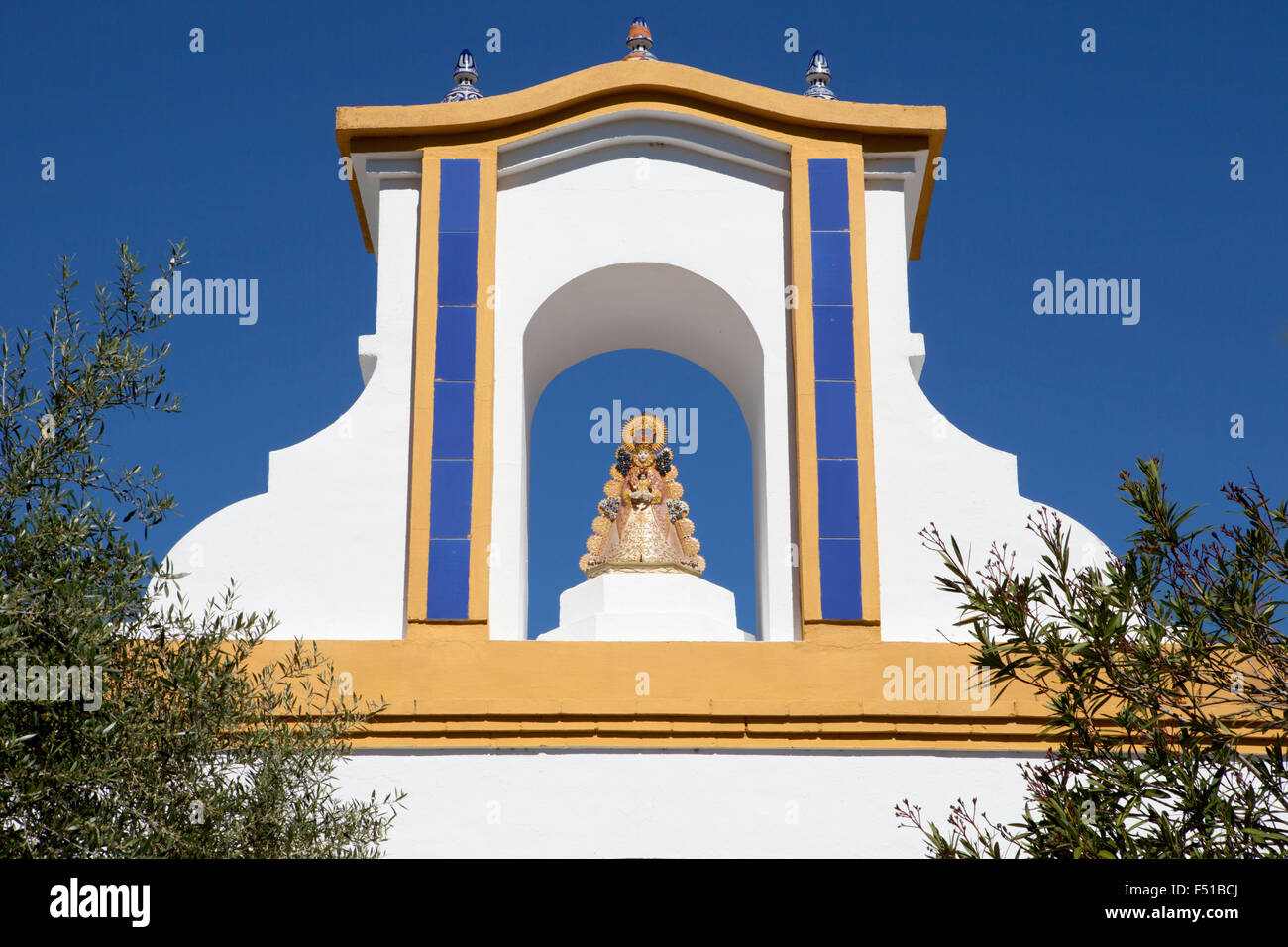 Clay Statue of the Madonna of El Rocio on the top of a rural house in Donana National Park, Spain Stock Photo